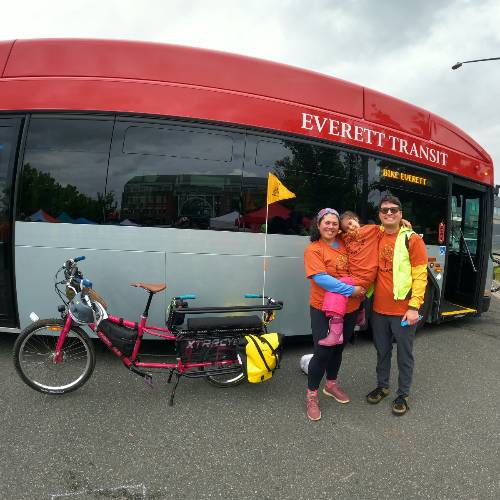 Luis with his wife and daughter infront of the Everett transit bus
