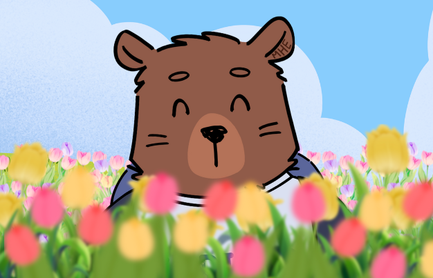 Kody bear smelling the tulips