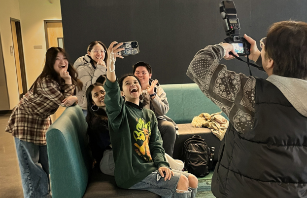 Students taking selfie in a photoshoot