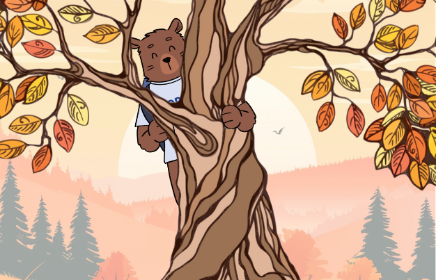 Kody bear behind a tree with orange leaves.
