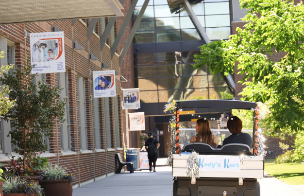 Cascadia campus cart friven by students.