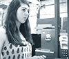 a thumbnail of female presenting student working at a computer