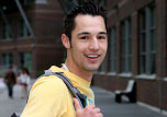 Happy student on promenade on campus