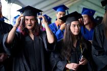 Cascadia College graduates in blue gowns and caps